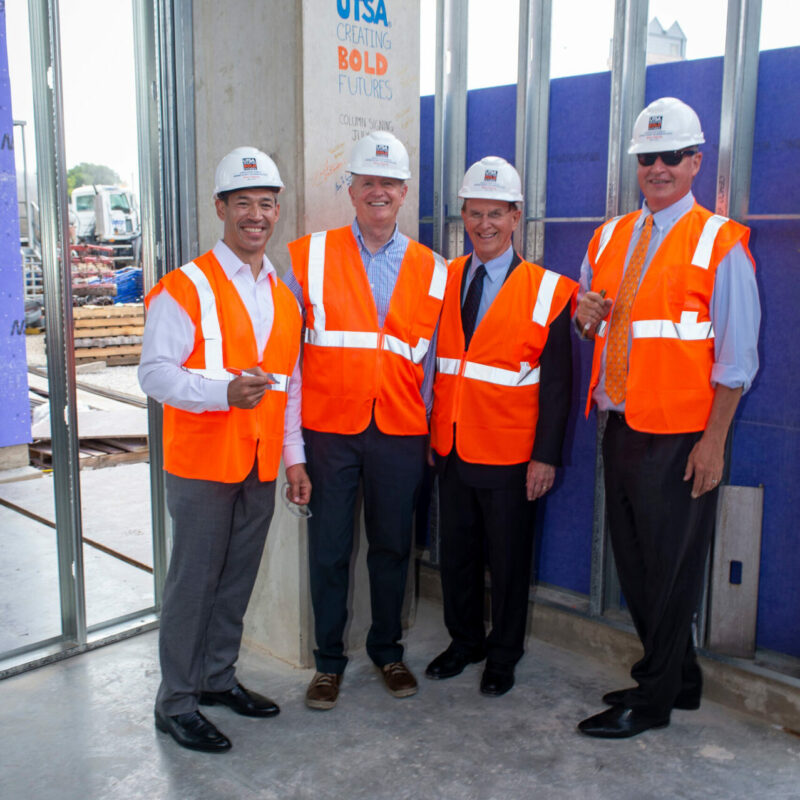 San Antonio Mayor Ron Nirenberg, Guy Walsh, executive director of the National Security Collaboration Center, Bexar County Judge
Nelson Wolff and UTSA President Taylor Eighmy pose for a photo at the beam signing ceremony for the new UTSA building downtown.