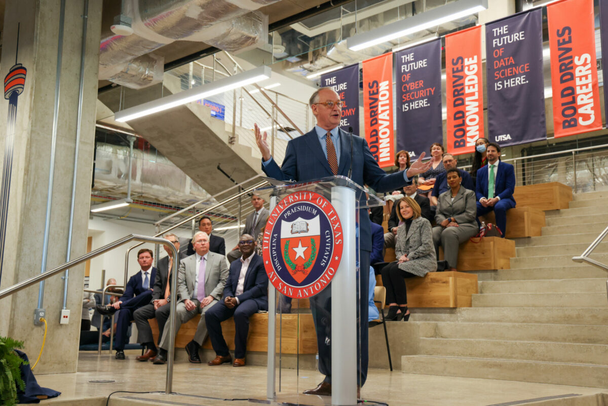 President Taylor Eighmy stands in front of a group of San Antonio community members giving a speech at the San Pedro I opening.