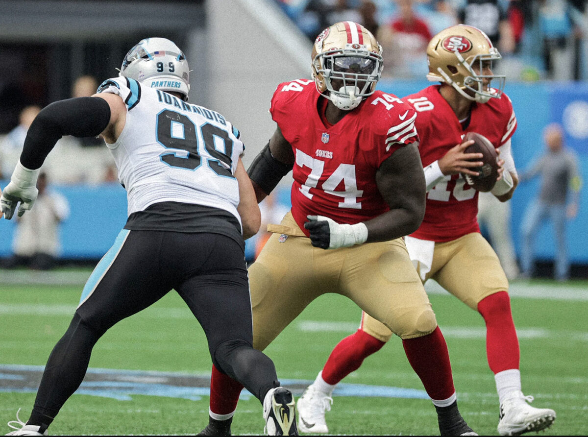 Spencer Burford positions himself in front of a Carolina defensive lineman.