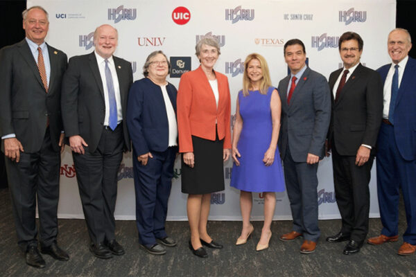 Taylor Eighmy and other university presidents pose for a photo at an event launching the HSRU.