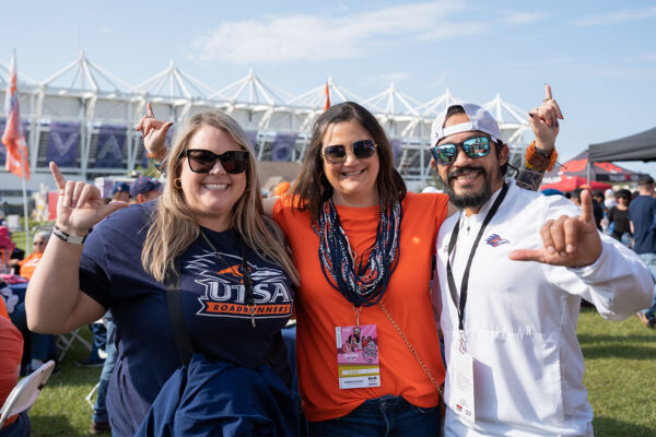 Three UTSA fans put their "birds up"