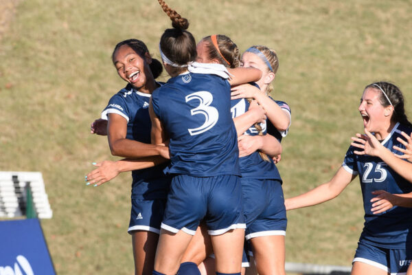 The UTSA soccer team celebrates on the field