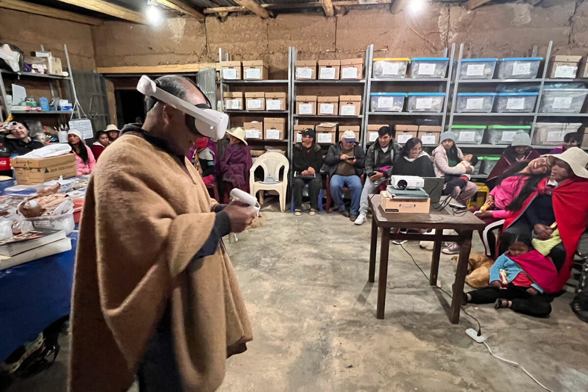 man with VR headset among a group of village onlookers