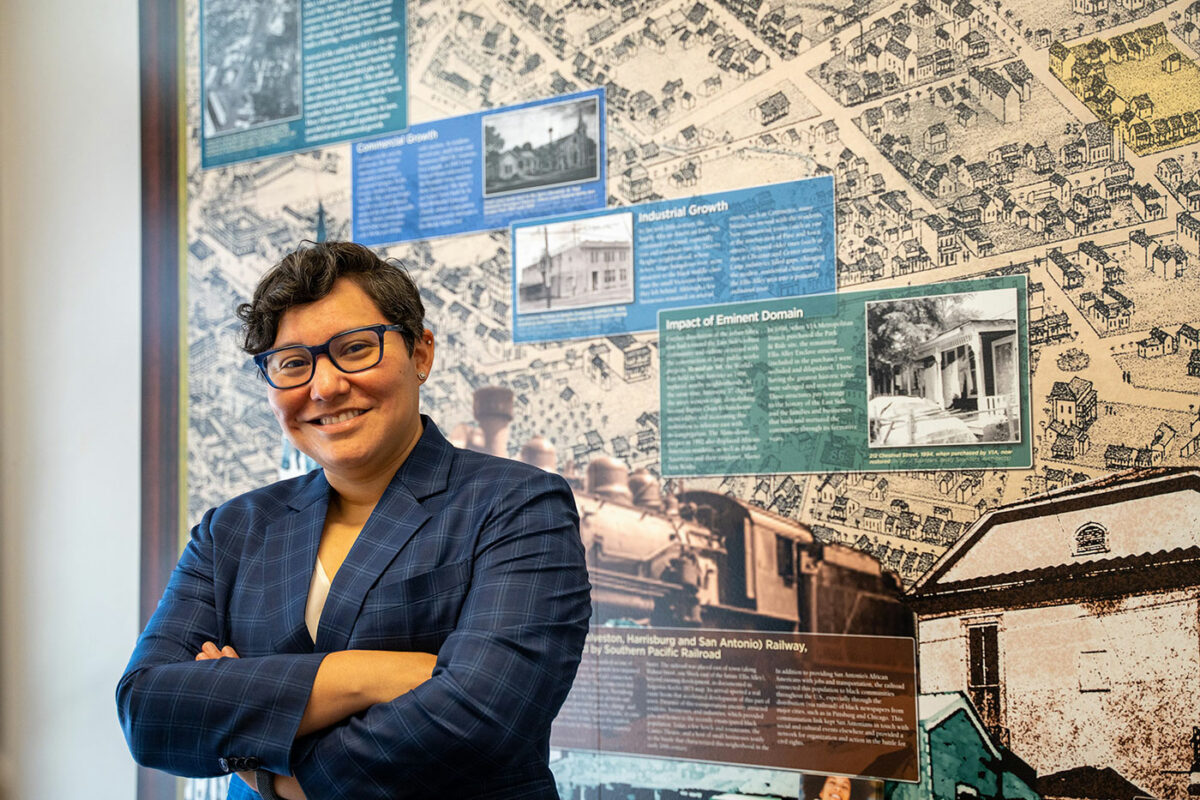 Mariella Ozuna stands in front of a map of San Antonio