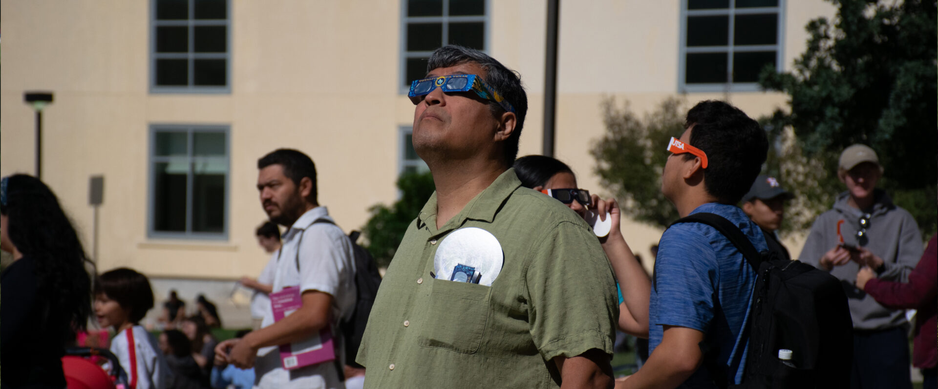 A man wears special glasses to watch eclipse