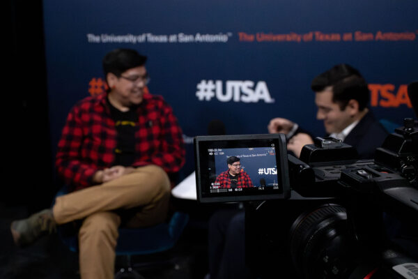 Cody Cly and host John Elizondo prepare for their interview in the Planet UTSA studio