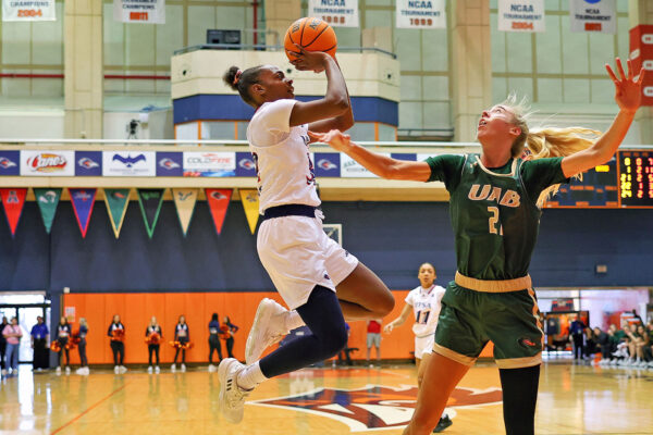 UTSA forward Jordyn Jenkins attempts a jump shot over a UAB defender