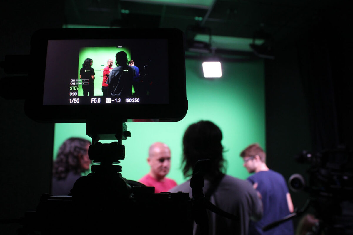 UTSA's Paul Ardoin organizes students during a green-screen shoot