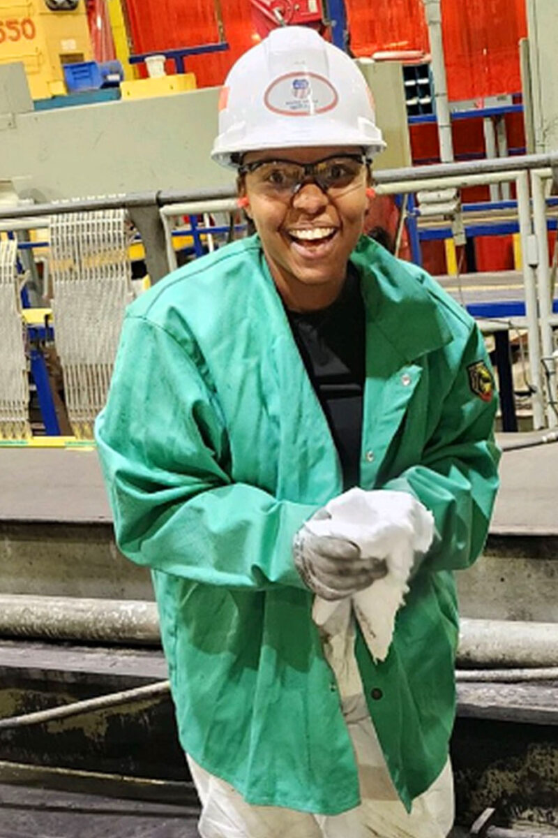 Taylor Richard smiles while working in the locomotive overhaul facility