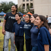 Devin Vassell posed for a photo with four delighted fans.