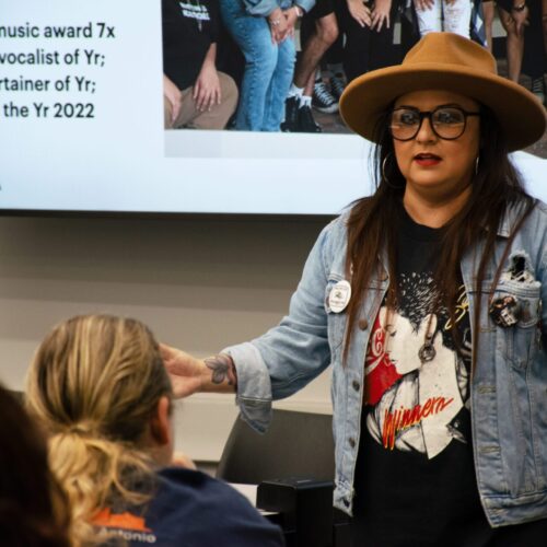 Woman talks to an audience.