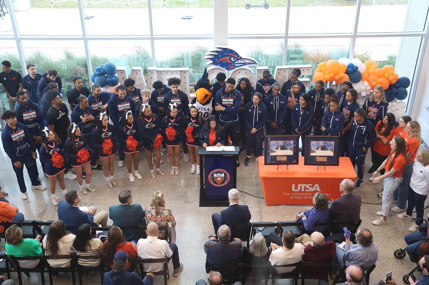 Lisa Campos speaks to a large crowd