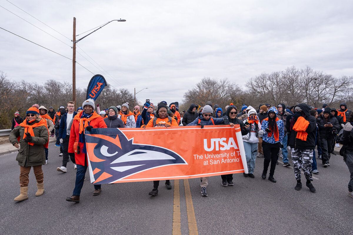 People hold a banner.