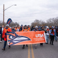 People hold a banner.