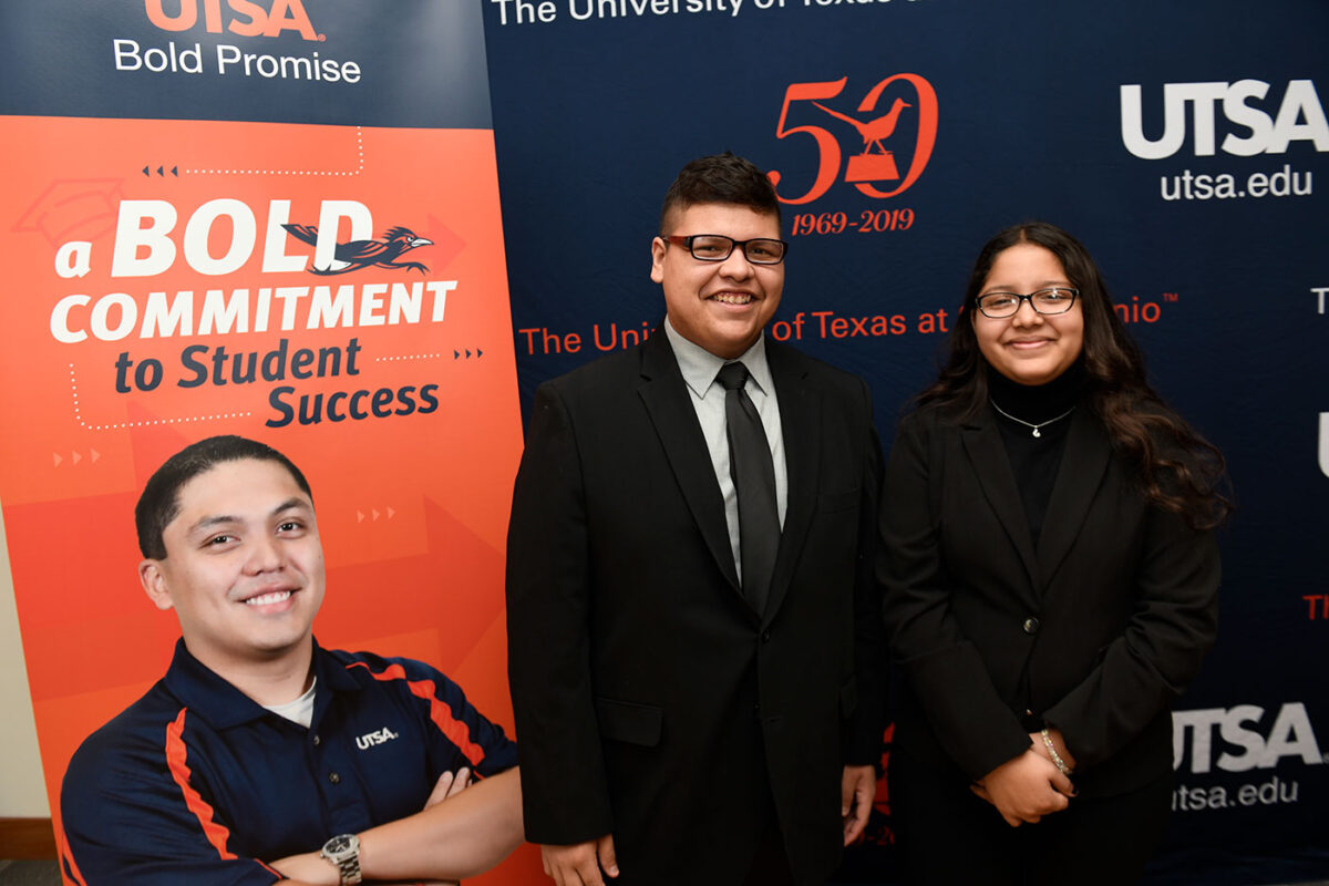 A man and woman are dressed in formal attire.