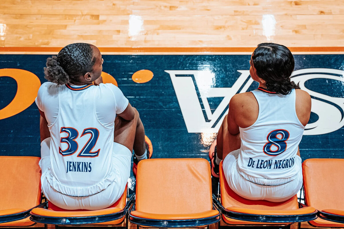 Jenkins and fellow senior Nina De Leon Negron share a brief exchange before their names are announced.