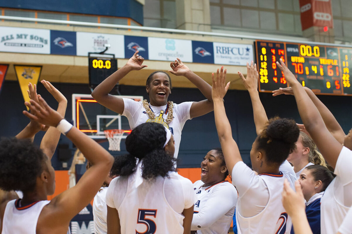 Jenkins' teammates hoist her up on their shoulders