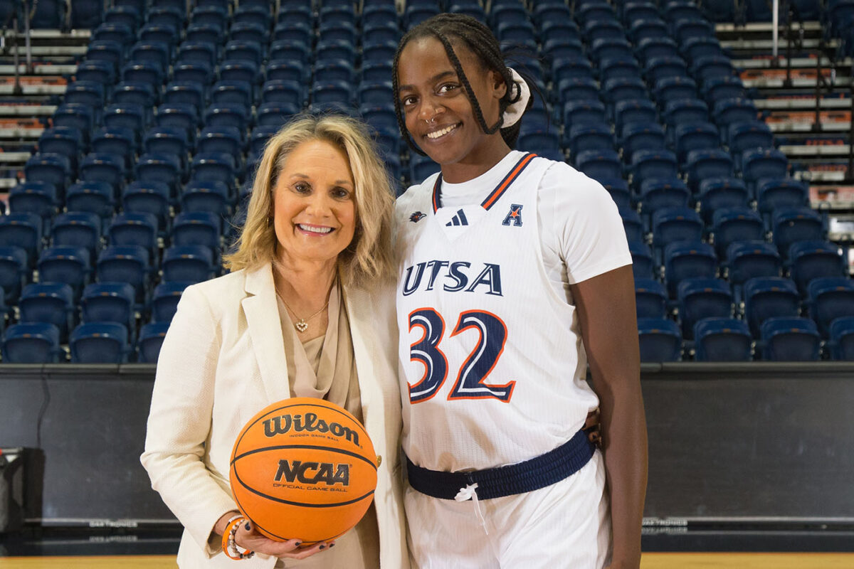Head coach Karen Aston poses for a photo with Jordyn Jenkins.