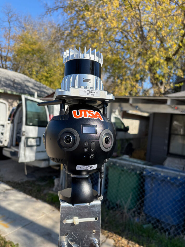 A black camera with the orange "UTSA" name on it.