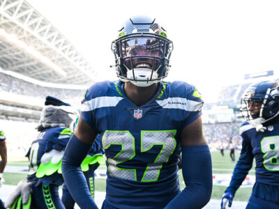 Tariq Woolen and other Seattle defenders hype up the crowd at Lumen Field.