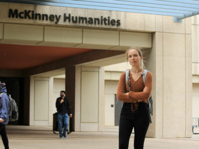 MJ Jones poses for a photo in front of the McKinney Humanities Building.