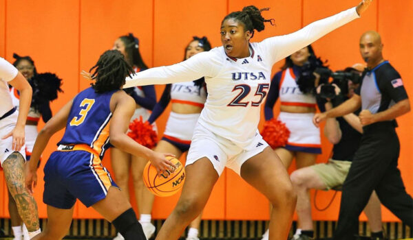 Idara Udo puts up her left hand to defend a potential pass