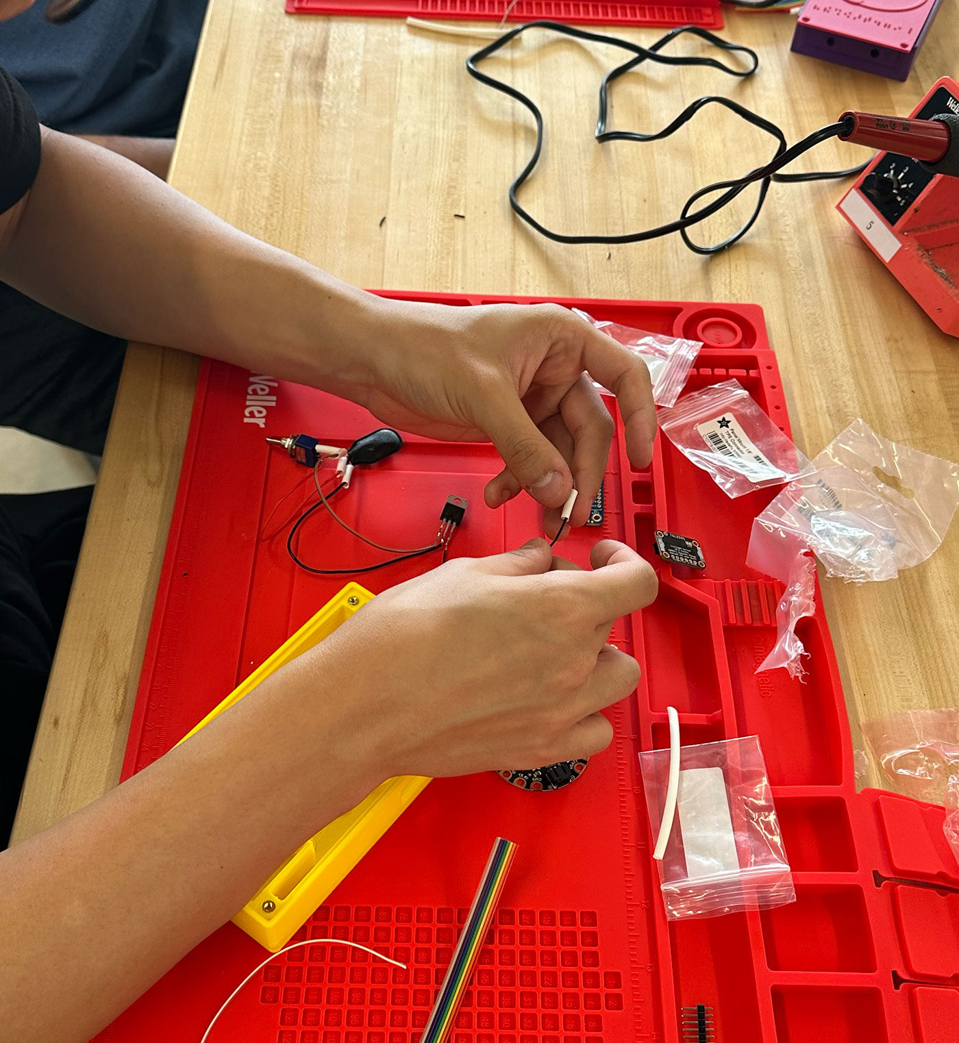 Student working on the light sound device
