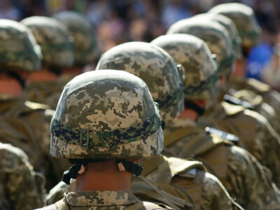 Rows of soldiers wearing military helmets