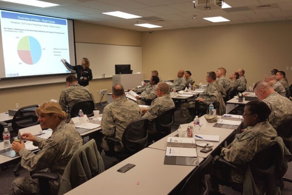 Natalie Sjelin gives a presentation to a classroom of National Guard members