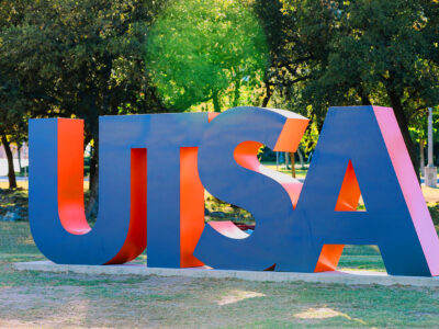 A colorful photo of large letters reading "UTSA."
